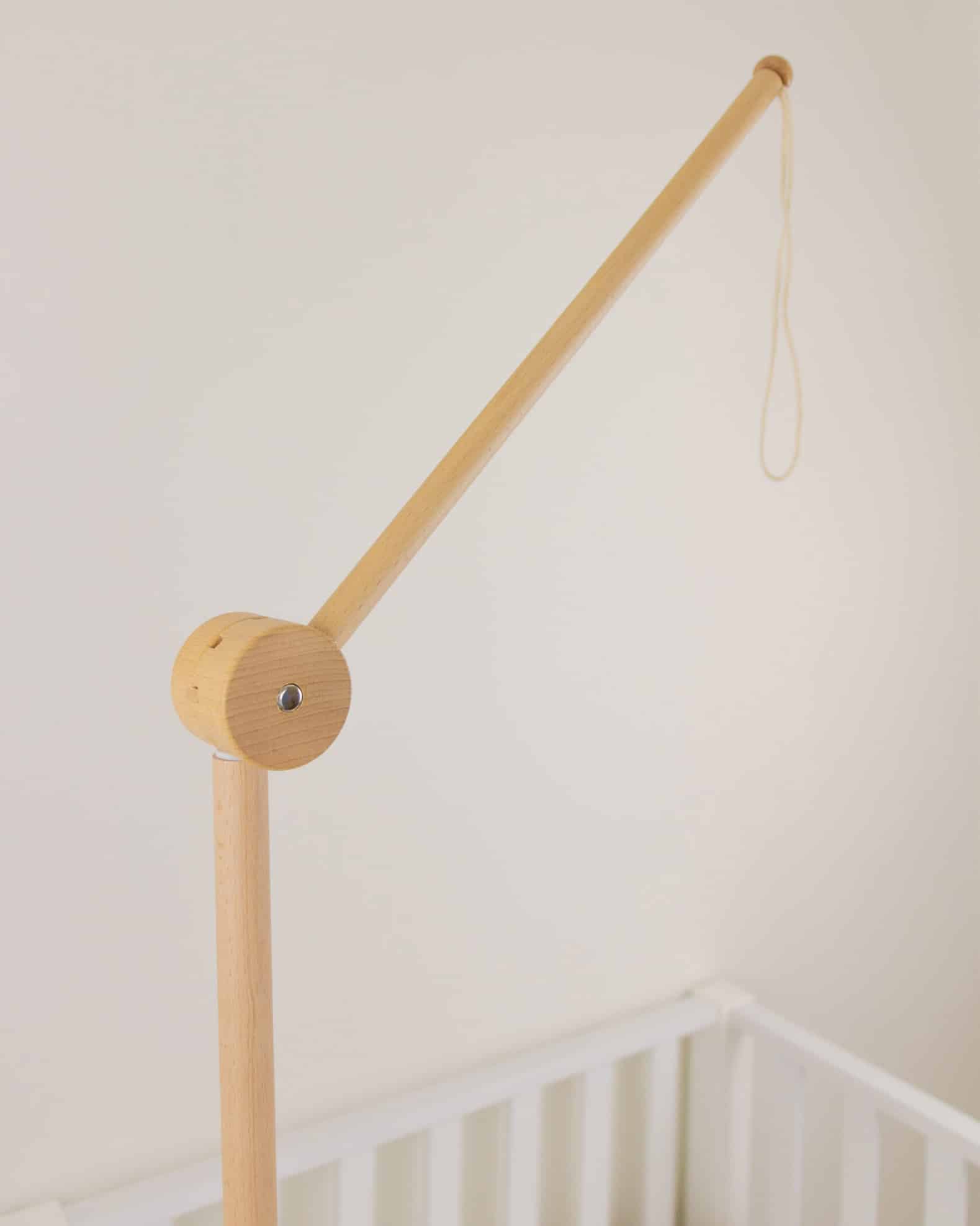 wooden arm attached to baby bed baby mobile, uro